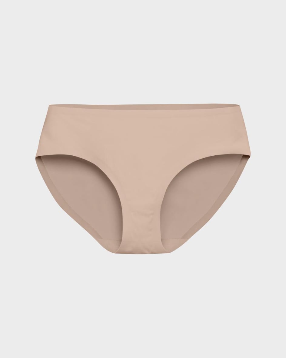 Beige seamless briefs photographed flat on a light grey background