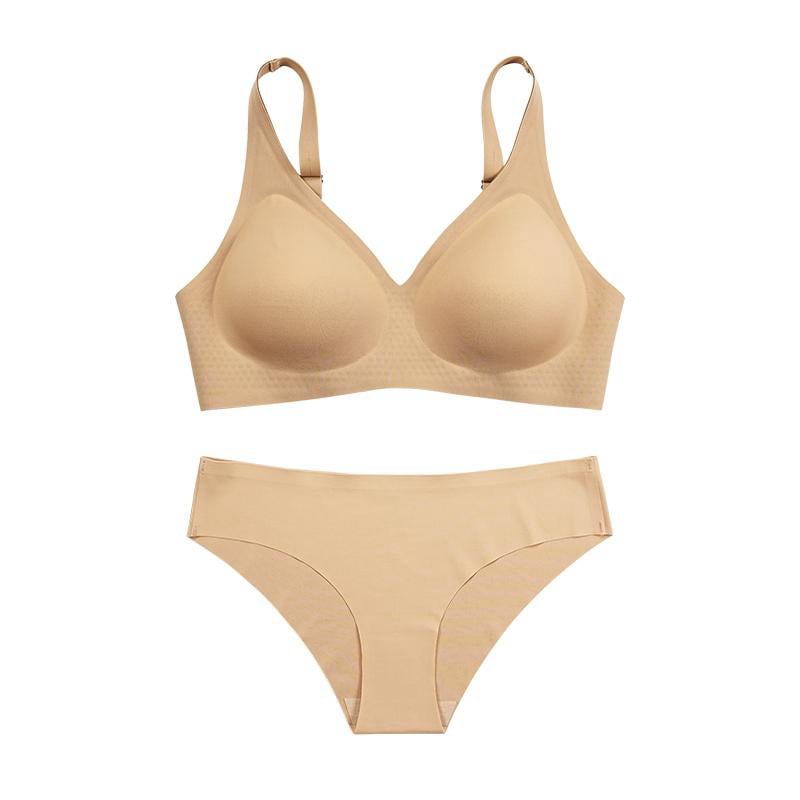 Beige seamless bra and briefs set photographed flat on a white background